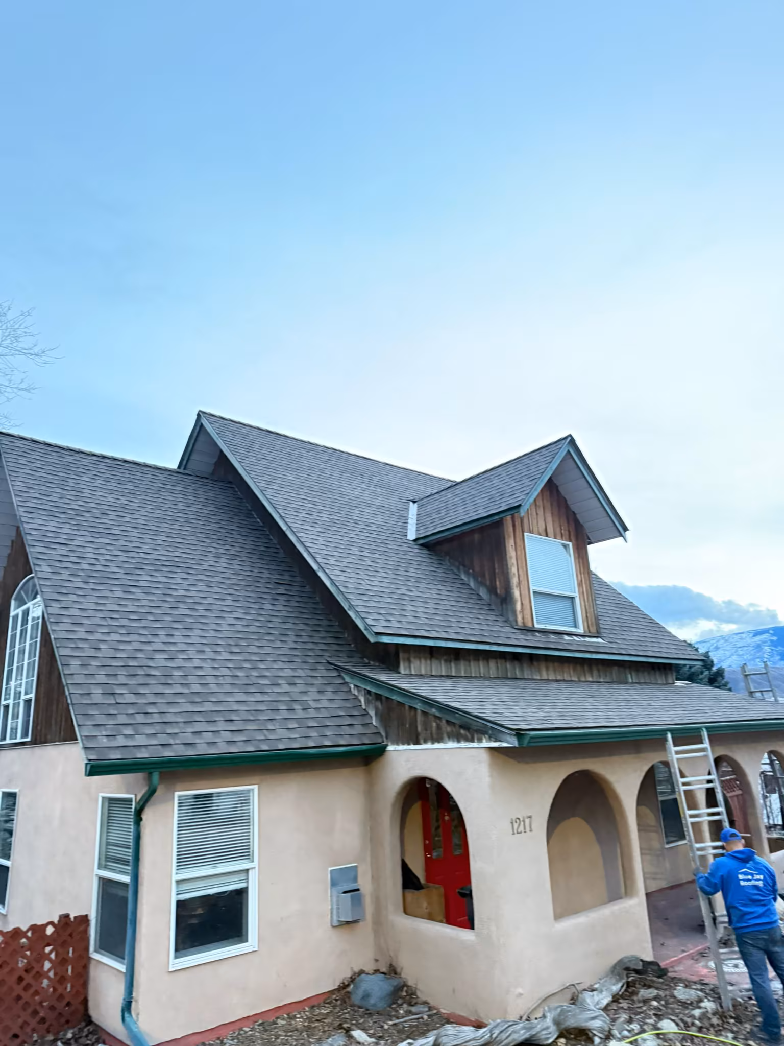 Finished architectural shingle roof with proper ridge vent installation — West Kelowna