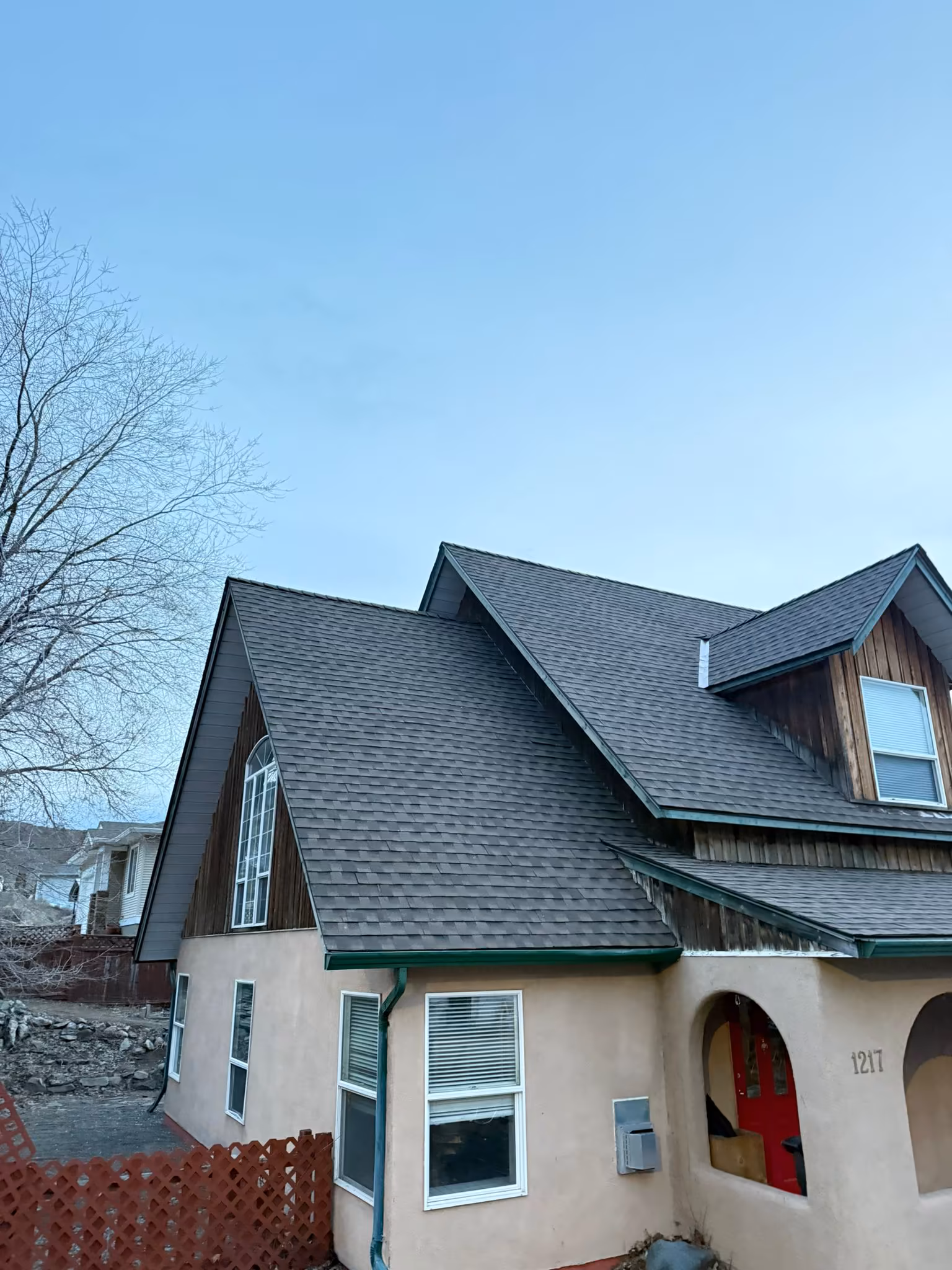 Professional roof repair addressing storm damage on residential property — Okanagan