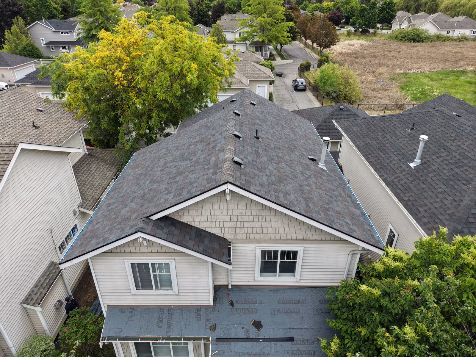 Overhead view of connected roof sections on a Lower Mission multi-unit property