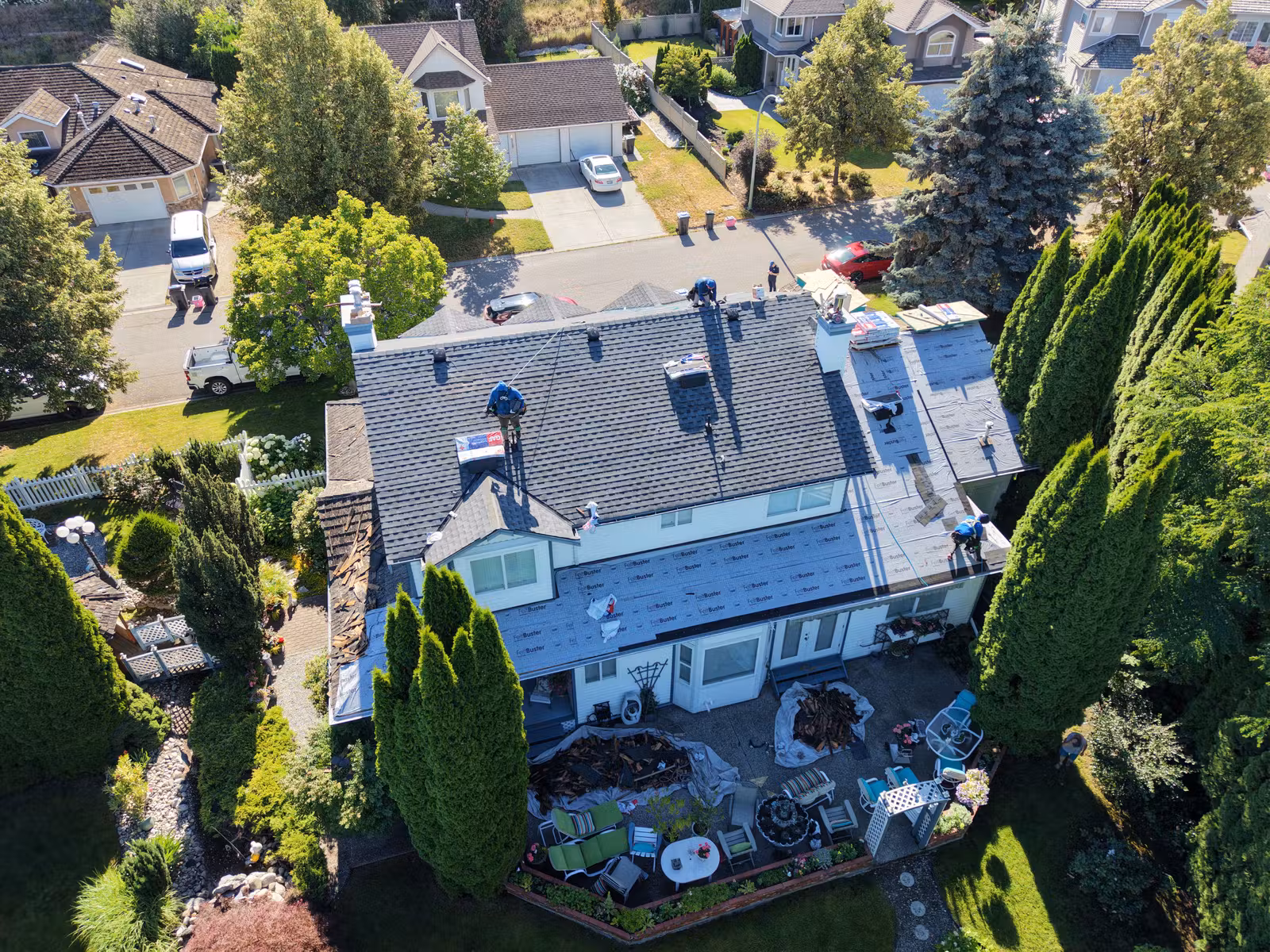 Roof tear-off in progress on an Eso Court area home in Kelowna