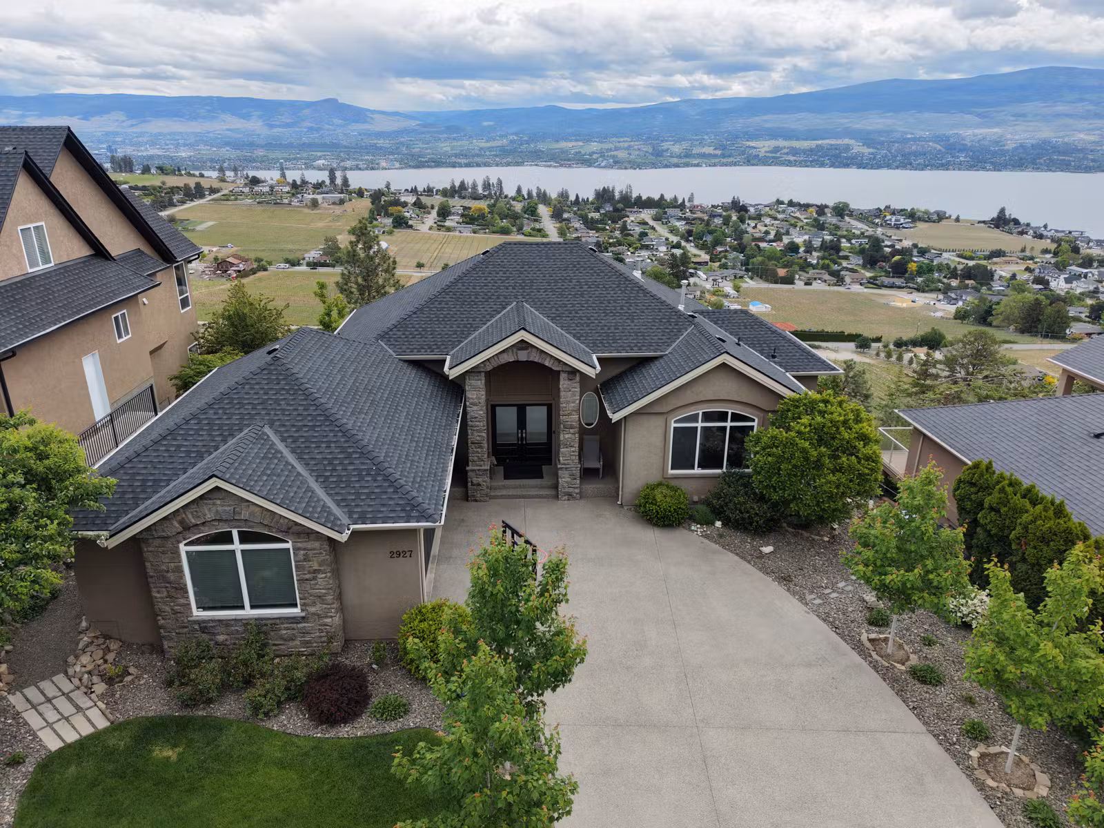 Aerial view of a Lakeview Heights roof and Okanagan Lake