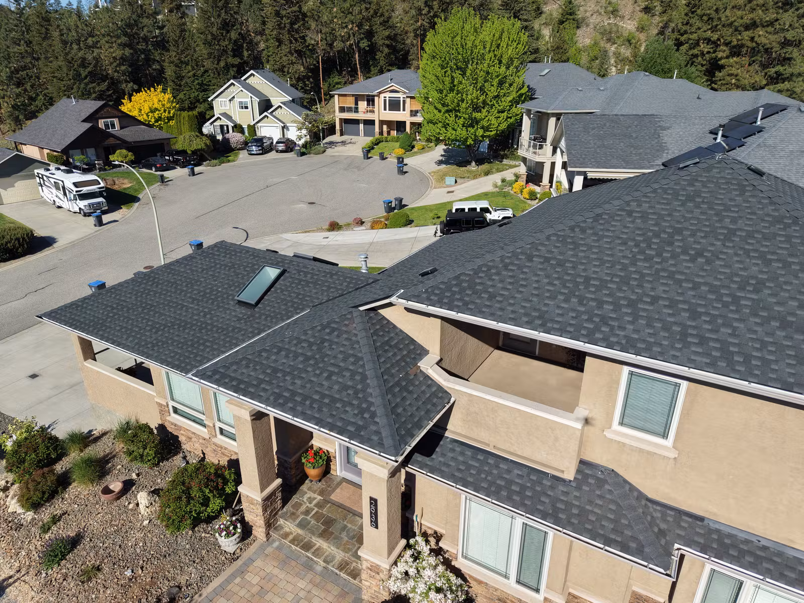 Close aerial view of roof slopes and skylight in West Kelowna