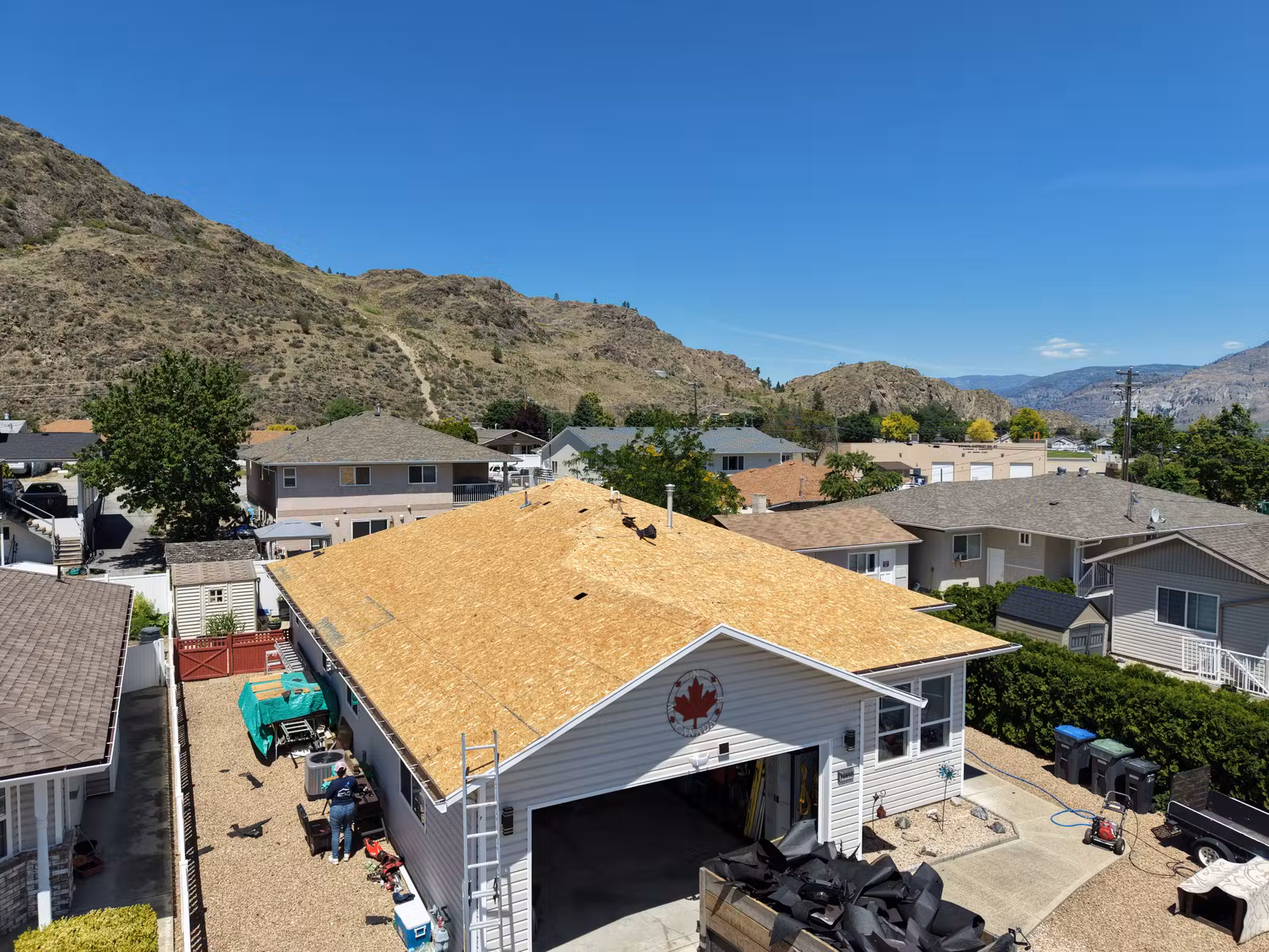 Oliver roof replacement at the exposed wood deck stage